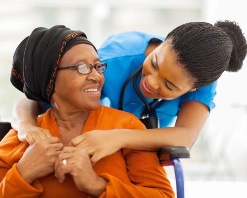 A nurse speaking to an older woman in a wheelchair. Are you looking for clinical supervision to be prepared to provide consultation for older adults? We provide Clinical Supervision in Washington, reach out today!