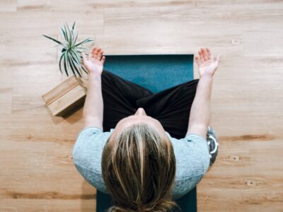 Female practicing mindfulness through yoga. Gain self- care tips from a clinical supervisor to avoid burnout. Learn more about group consultation in Washington, TX, CO & NC.