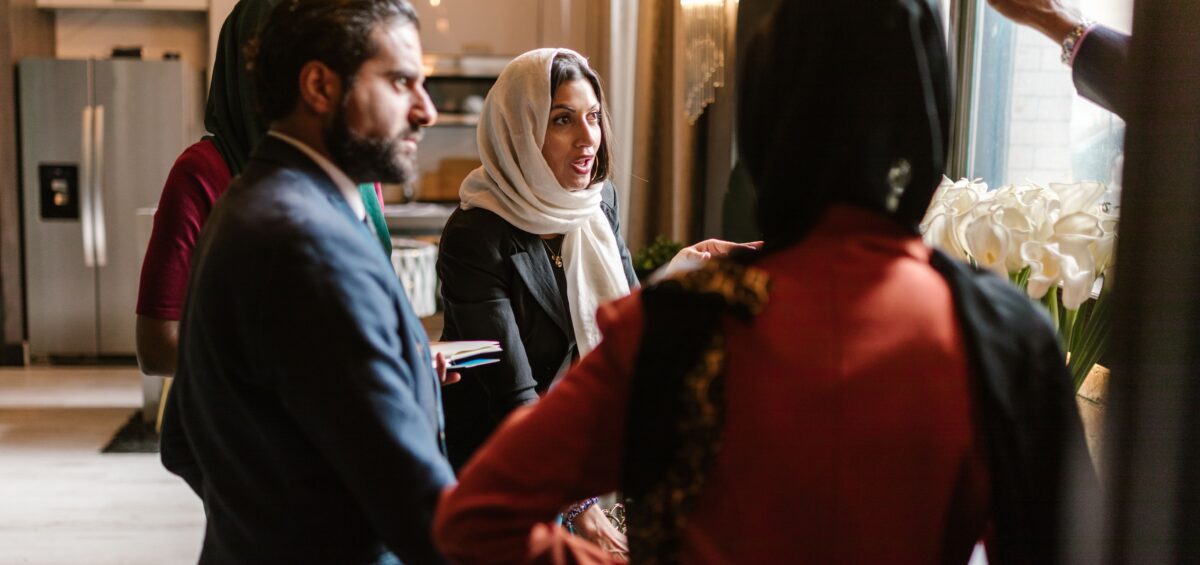 A small group of therapists in conversation, representing the peer connection and community that clinical supervision can provide.
