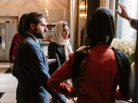 A small group of therapists in conversation, representing the peer connection and community that clinical supervision can provide.